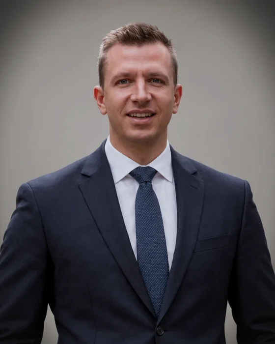 Anton Sotov, head and shoulders, in a dark suit